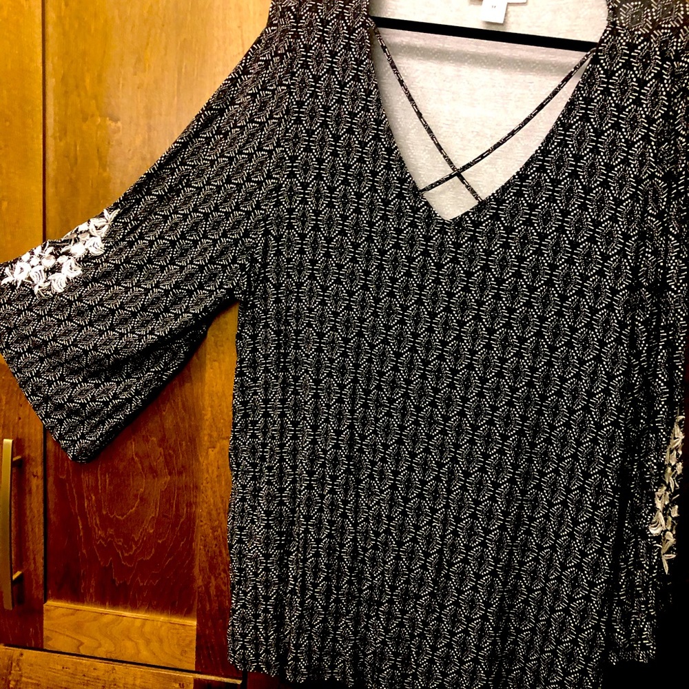 Beautiful bell sleeve blouse with embroidered details on the bell sleeves